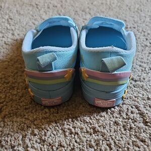 Vans Kids Light Blue Slip-On Sneakers with Rainbow Stripes and Star Accents